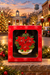 Poinsettia Mayberry ornament in its red gift box against a festive Mayberry-themed backdrop